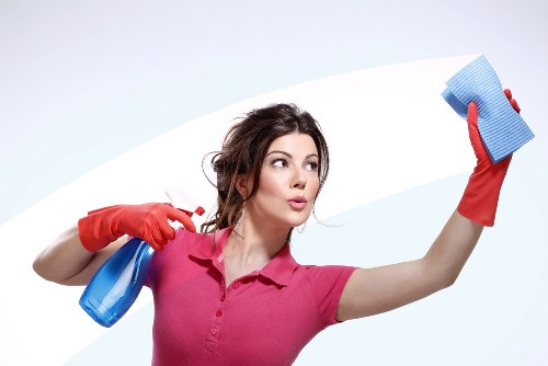 Professional cleaner working in a W2 apartment building